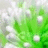 Pixelated green and white abstract composition with scattered light patches against a muted background.