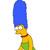 Pixelated character with bright blue hair, yellow skin, red collar, green clothing, and white eyes with black pupils in profile view.