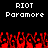 Pixelated text 'RIOT' and 'Paramore' above red pixelated crowd with raised hands on black background.
