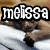 A sleeping brown monkey on white fabric with text overlays reading 'melissa', 'loves', and 'monkeys' in white block letters with black outlines.