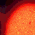 A pixelated orange and yellow figure with a rounded head, closed eyes, and a wide smile appears in multiple showing motion
