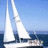 A sailboat with white sails on blue water under a clear sky, paired with text elements on colored backgrounds.