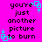Bright pink background with black text reading "you're just another picture to burn" and cyan square-shaped pixel art elements scattered across the image.
