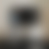 A static image with a gradient background transitioning from light gray to dark gray, featuring no discernible subjects or objects.