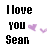 Static pixel art displays 'I love you Sean' in bold black text with two purple heart icons on a white background.