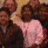 A static image with a blue background and pixelated text reading "GET IN LINE" alongside a small, blurry photo of people.