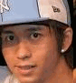 Two side-by-side static frames of a person wearing a light blue and white baseball cap with visible New Era logo, showing different facial expressions in each frame.