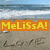 Beach scene with ocean waves and sand, overlaid with orange banner displaying 'MeLiSSa!' in yellow pixelated text.