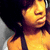 A person with dark hair and a black tank top appears in four showing slight head movement