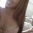 A pixelated close-up of a person's torso and arm with blurred background elements.
