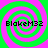 Four identical spiral patterns with alternating green and pink rings, each containing the text "Blakem32" in black pixelated font.