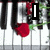 Animated piano keyboard with red roses and green vines, displaying text 'I love you' in black-and-white block letters.