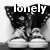 Black-and-white pixelated image of a pair of boots with the word 'lonely' overlaid in white text.