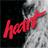 A black-and-white image of two people in close proximity with a red 'heart' text overlay on the left side.