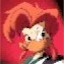 Pixelated cartoon character with red hair and white face against solid red background, static single-frame image.