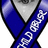 Blue ribbon with white text crosses over a grayscale image of a person's face, next to blue pixelated text on black background.