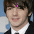 Pixelated image of a person in a black suit and white shirt with pink text overlays reading 'i', 'love', and 'drake bell.('