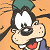 Pixelated cartoon character with large white eyes, black hair, and red mouth against orange background.