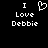 Pixelated black background with white text and a heart symbol, showing two side-by-side variations of the phrase "I Love Debbie" where the heart symbol appears in the left version.