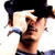 Static pixelated image of a person's face and upper body with dark hair, light skin tone, and visible facial features including eyes, nose, mouth, and ear, wearing a dark top against white background.