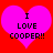 Two identical pink hearts on red background with black text reading "I LOVE COOPER!!" in pixelated font.