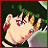 Pixelated anime-style character with green hair and red eyes, wearing a black outfit with red accents, positioned against a dark background with green foliage.