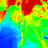 A static pixelated image with a gradient of green, yellow, red, and blue hues forming an abstract pattern with no discernible subjects or text.