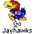 Pixelated mascot icon with blue body, yellow beak and feet, red head crest, wearing a jersey with 'KU' letters, below text reading 'Go Jayhawks' on gray background.