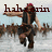 A pixelated figure in pirate attire performs a dynamic pose with arms extended, set against a blurred crowd background.