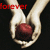 Two hands hold a red apple against black background with text overlays changing from 'forever' to 'begins' and 'today'.