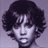 Pixelated grayscale portrait of a person with voluminous curly hair against a solid background, rendered in low-resolution 256x256 pixels.