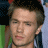 Pixelated image of a person with short brown hair and light skin, next to green text reading 'OriginalIcons.com' on dark background.
