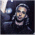 A 50x50 pixel animated buddy icon featuring a person with long hair and sunglasses on the left side, paired with green text reading "Original Icons .com" on a dark background.