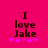 A bright pink background displays the text "I love Jake" in dark brown pixelated letters with five purple plus signs below, where the leftmost and rightmost plus signs change from solid to outlined between frames.
