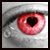 Pixelated close-up of a human eye with red sclera and black pupil, set against gray-toned background elements.