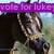 Animated image of a horse with a purple banner reading 'vote for luke? Please vote' above it.