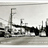 Pixelated grayscale image of a building with vertical and horizontal lines, possibly a theater or public structure, on a light background.