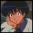 Pixelated anime-style character with dark hair and wide eyes rests chin on hand, wearing light jacket over dark shirt against gray background.