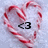<3 heart-shaped candy cane swirls on light blue background with black pixelated text <3 in center.