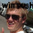 Pixelated image of a person with light brown hair wearing dark sunglasses and a white shirt, with partial text overlay above the head.