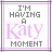 Two side-by-side pixelated text with 'I'M HAVING A Katy MOMENT' in gray and purple lettering, framed by intersecting lines