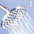Animated sequence of shower head with water spray, text fragments 'I love sing in the shower', and heart symbols on light blue background.