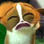 Pixelated close-up of a cartoon character with orange hair, closed eyes, and an open mouth showing teeth.