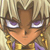 Pixelated close-up of a character with light brown hair, purple eyes, and an orange face wearing yellow and purple clothing.