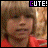 A child in a red shirt appears with the word CUTE! above, showing subtle facial expression changes