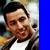 Animated contact sheet of Adam Sandler frames with blue vertical bars containing yellow text, showing slight facial expression changes across six sampled frames.