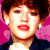 Pixelated image of a person with short brown hair and red lipstick, next to bold text reading "I love the 80's" on a pink and light blue background.