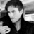 Black-and-white photo of a person in dark clothing with red text overlays reading 'I', 'LOVE', and 'ENRIQUE' across different sections.