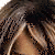 A 50x50 pixel animated buddy icon featuring a close-up of a woman with long brown hair wearing a white top, displayed as part of a contact sheet with three sampled frames showing subtle facial expression changes.