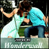 A couple in a romantic pose with text overlay reading "YOU'RE MY Wonderwall" on a green banner.